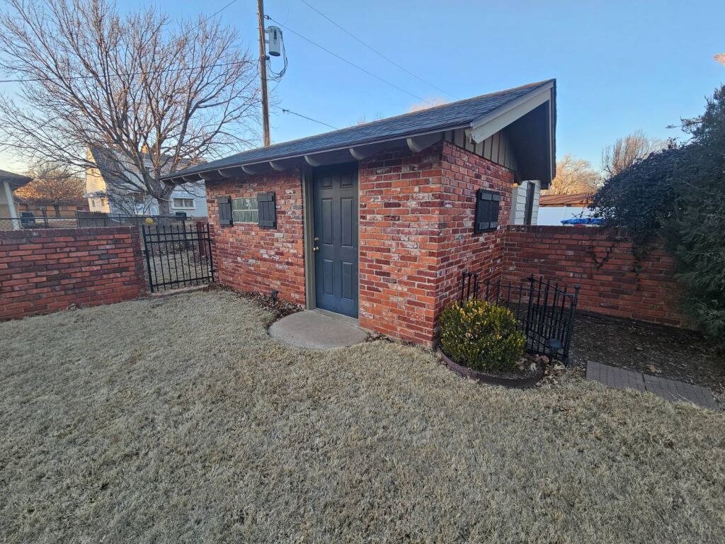 824 Marvin St. in Kiowa, Kansas — Side yard