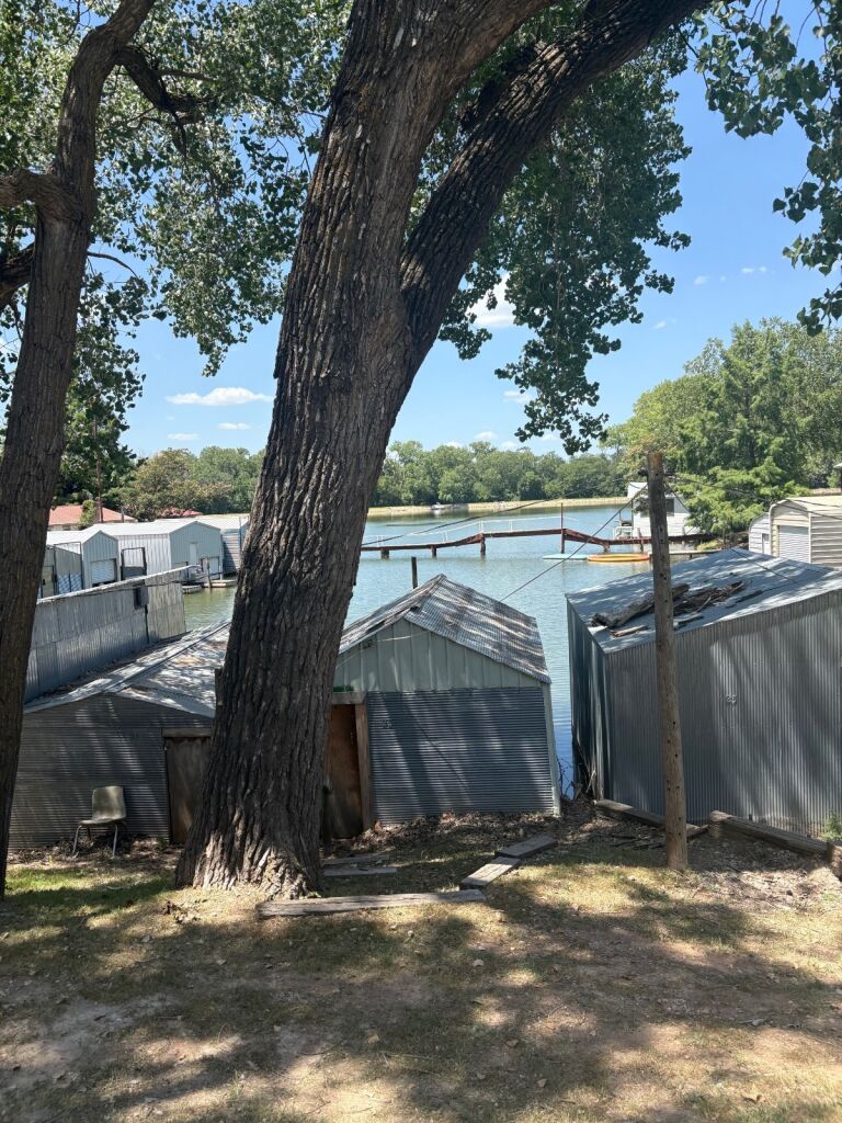 231 Hummingbird Rd. in Medicine Lodge, Kansas — Yard and lake