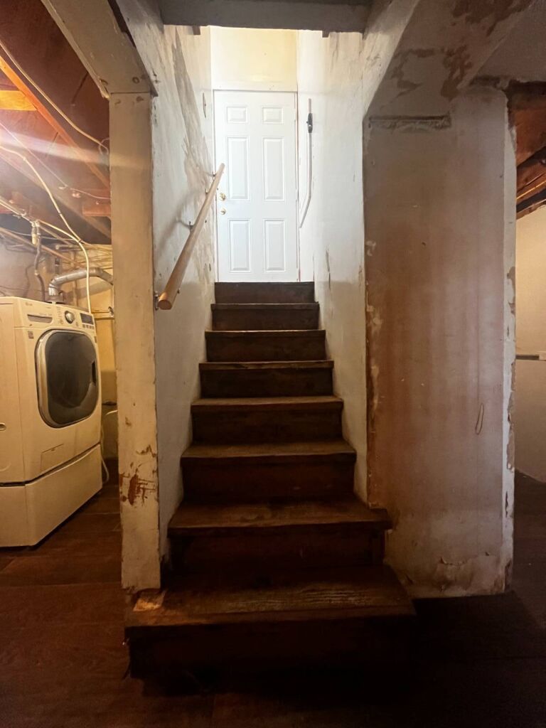 311 W. Kansas Ave. in Medicine Lodge, Kansas — Basement stairs and laundry