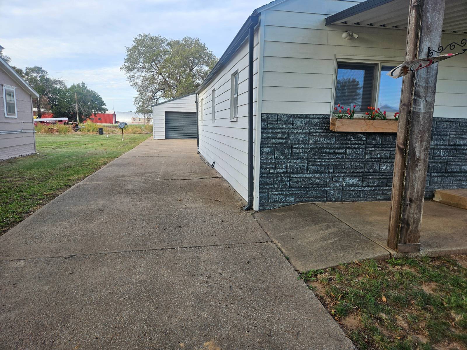 430 Campbell St. in Kiowa, Kansas — Driveway and side of the house